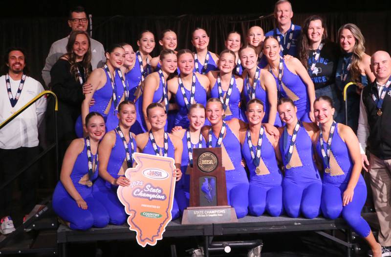 Members of the Geneva High School dance team pose with their Class 2A championshiip trophy during the IHSA State Dance finals on Saturday, Feb. 1, 2025 at Grossingers Motor Arena in Bloomington.