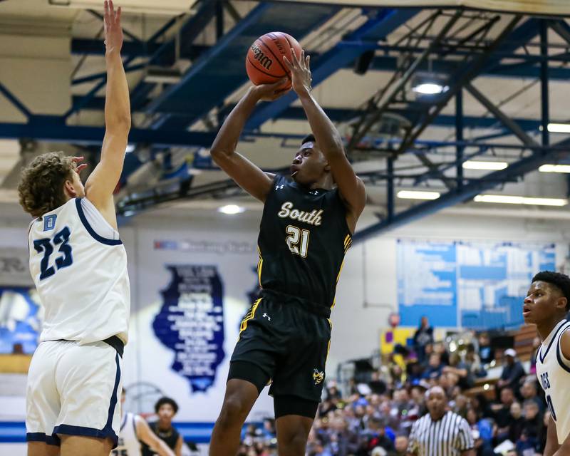 Hinsdale South's Gemarion Alexander (21) shoots a fade a way during basketball game between Hinsdale South at Downers Grove South. Dec 1, 2023.