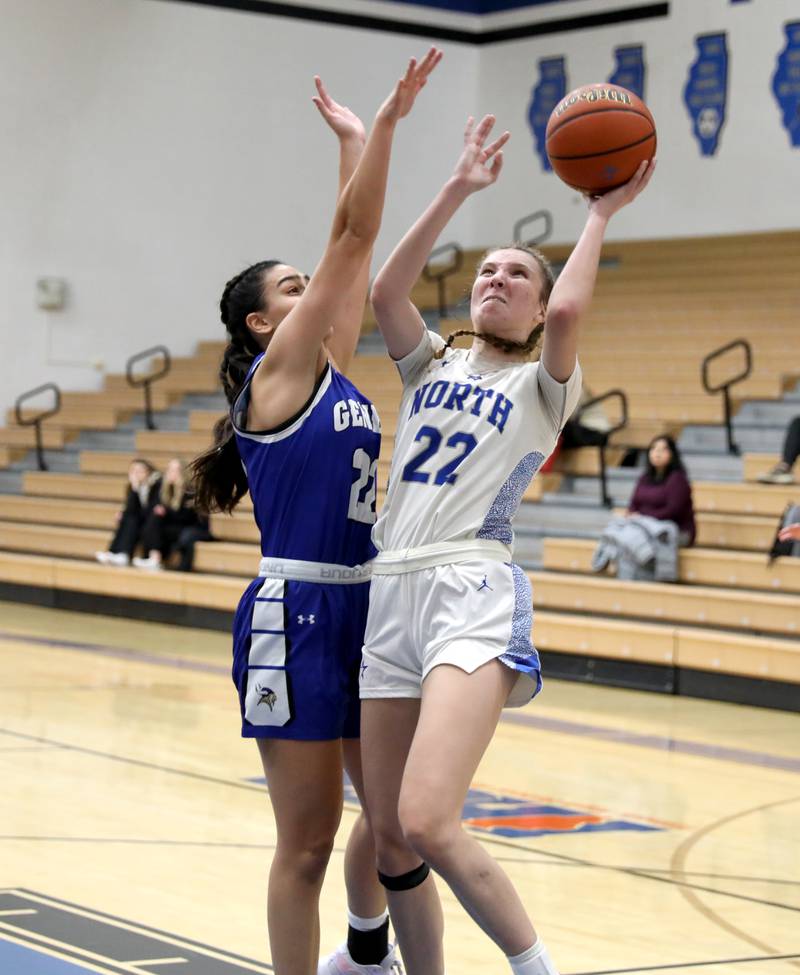 St. Charles North’s Katrina Stack shoots the ball over Geneva’s Leah Palmer during a game at St. Charles North on Tuesday, Jan. 9, 2024.