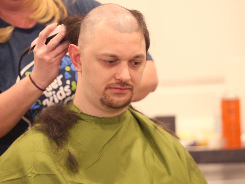 Jake Burkhardt has his head shaved during the 18th annual Illinois Valley Emergency Services St. Baldrick's event on Sunday, March 23, 2025 at Senicas Oak Ridge in La Salle.