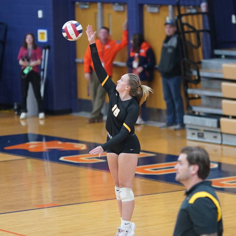 Joliet West's Peyton Darguzis (18) serves the ball against Lincoln-Way West during a class 4A Oswego Sectional semifinal match at Oswego High School on Monday, Oct. 30, 2023.