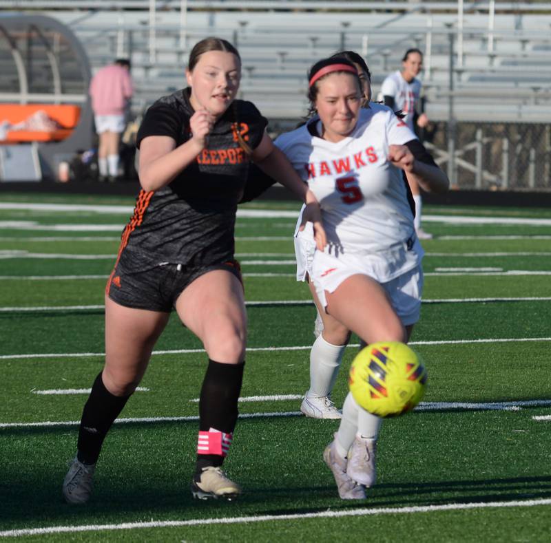 Oregon's Ava Carenno (5) and Freeport's Natalie Namio (12) race after the ball during a Monday, March 31, 2025 game at Freeport High School.