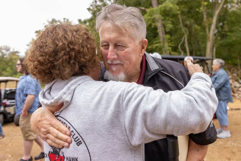 Kevin Coleman celebrates the new bridge named after him with friends during the ribbon cutting ceremony of The Wetlands Bridge at 501 3rd Street on September 20, 2025 in Hennepin.
