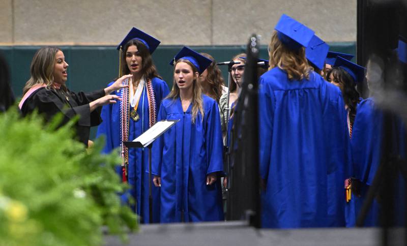 Wheaton North graduates sing with the Chamber Singers during the school's commencement ceremony on Saturday, May 24, 2025 at College of DuPage in Glen Ellyn.
