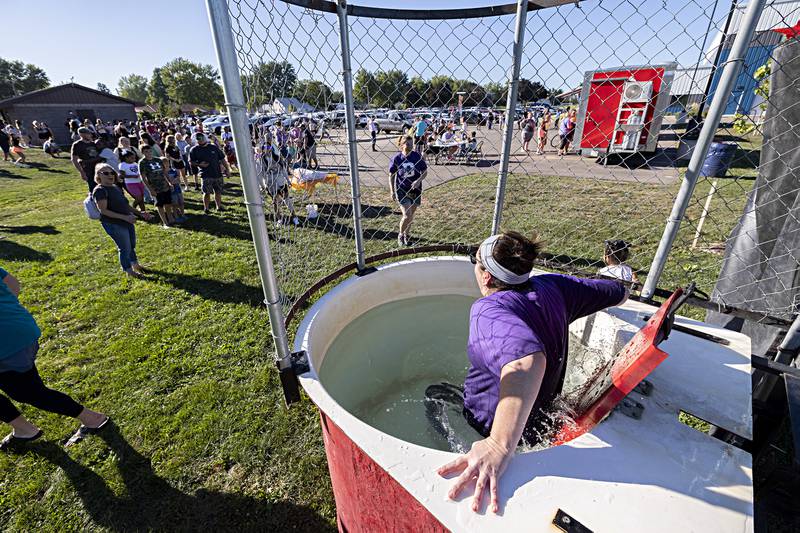 Jefferson School assistant principal Kelly Full takes a dip in the dunk tank Thursday, August 31, 2023 during a welcome back to school fun day sponsored by the Dixon Parent-Teacher Organization.
