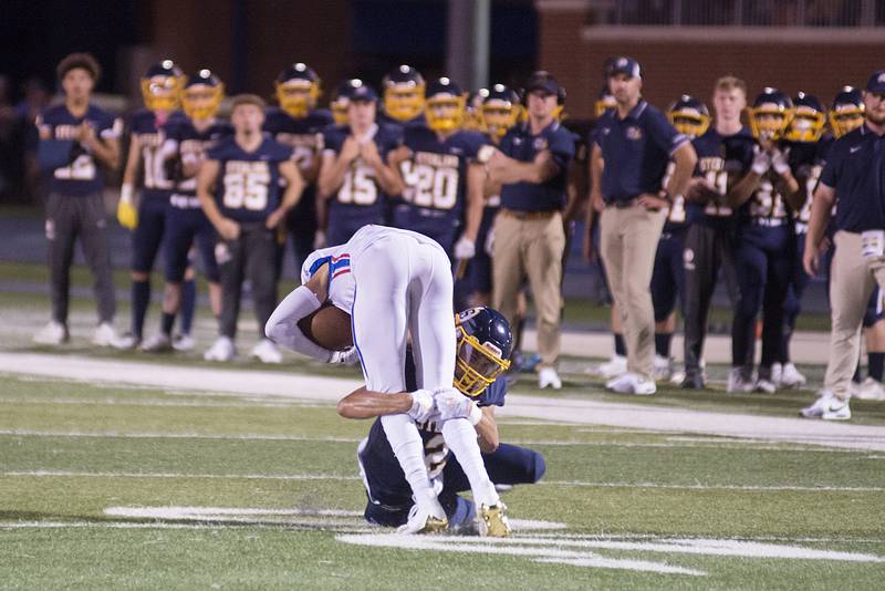 Sterling’s JP Schilling makes a tackle on Lakes' Tyson Dewey Friday, Aug. 26, 2022.