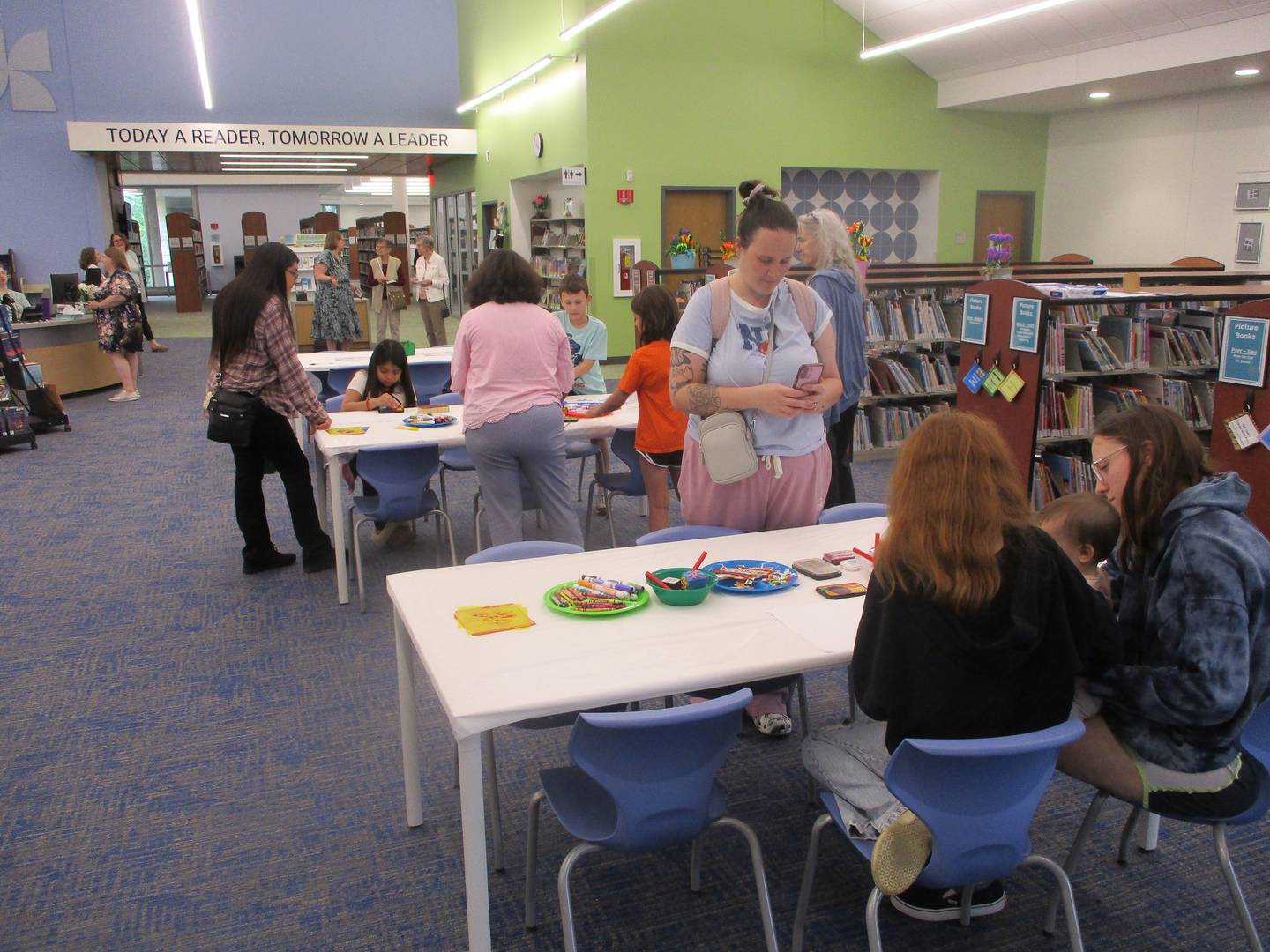 Families work on art projects during an open house held Friday to showcase renovations at the Joliet Public Library Black Road Branch. April 24, 2026