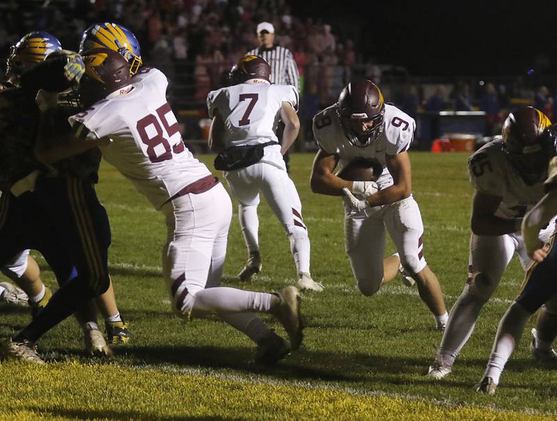 Richmond-Burton's Daniel Kalinowski runs for a touchdown during a Kishwaukee River Conference football game against Johnsburg  on Friday, Oct.6, 2023, at Johnsburg High School.