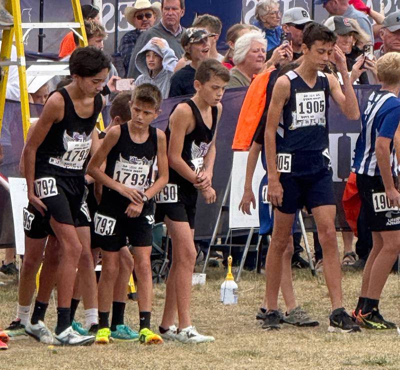 The Dixon junior boys cross country team prepare for their run on Saturday.
