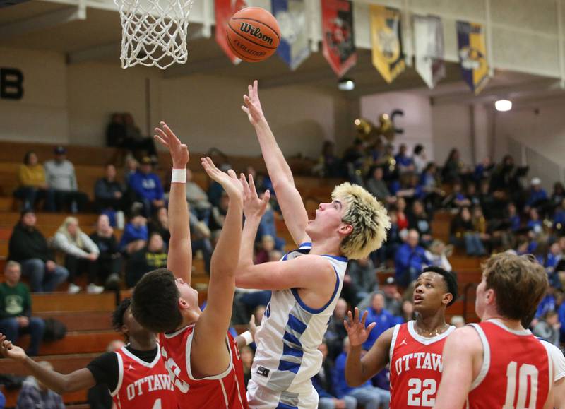 Princeton's Noah LaPorte shoots a shot over Ottawa's Cooper Knoll on Monday, Feb. 5, 2024 at Prouty Gym.