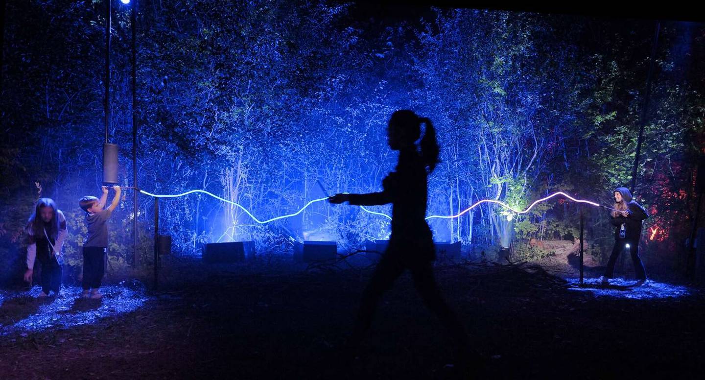 Children pretend to play a wand battle at the “Harry Potter: A Forbidden Forest Experience” in Ingleside during a sneak preview for friends and family members of employees and media. The experience opens Friday night and runs through Nov. 2.