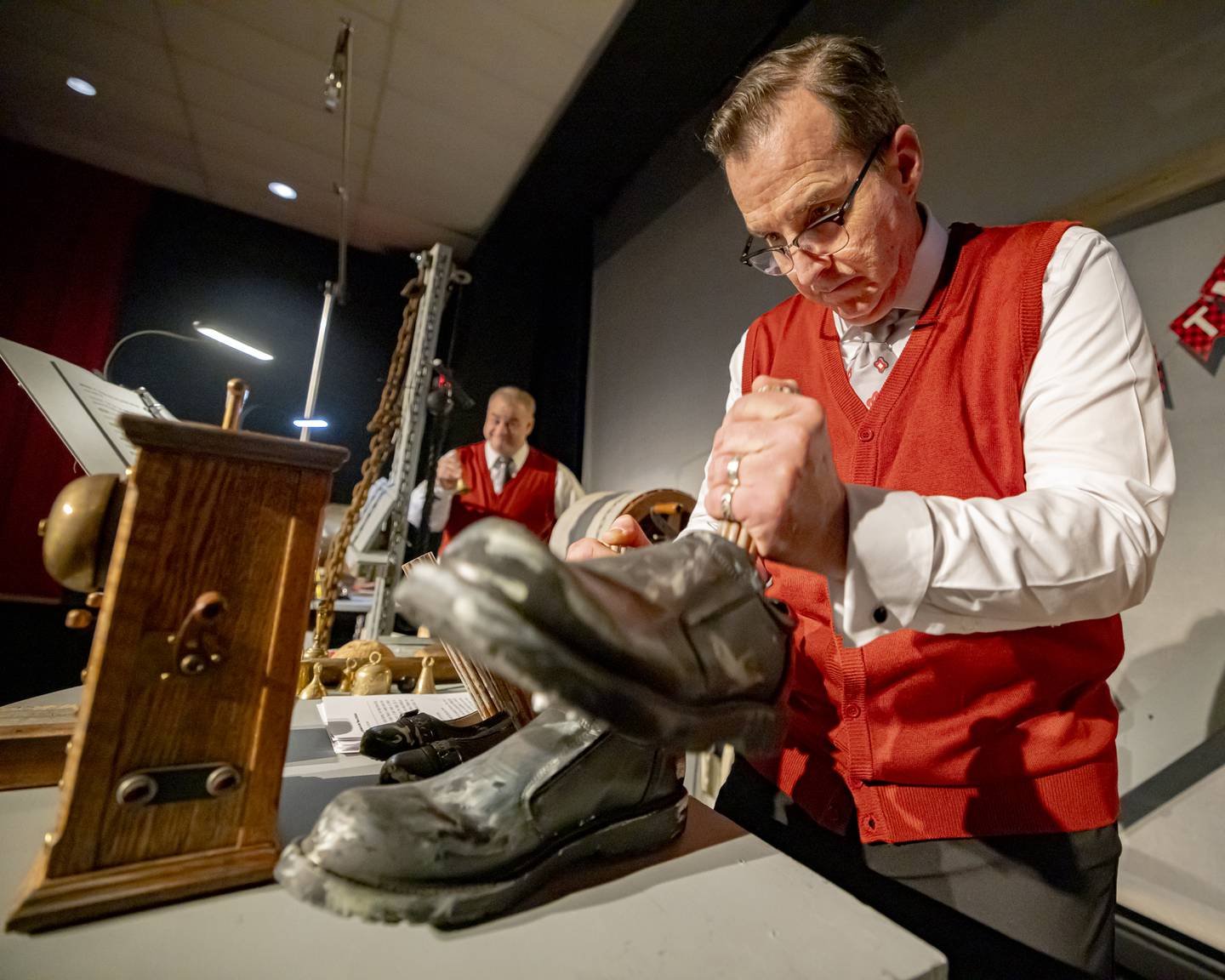 Dave Roden uses a set of shoes to make a stomping sound effect during a rehearsal for the radio show, "A Christmas Carol: The Ghosts of Christmas" on Nov. 23, 2024, at Stage 212. “A Christmas Carol: The Ghosts of Christmas” will be staged at 7:30 p.m. Friday, Dec. 6 and at 2 p.m. Sunday, Dec. 8 at the La Salle theater.