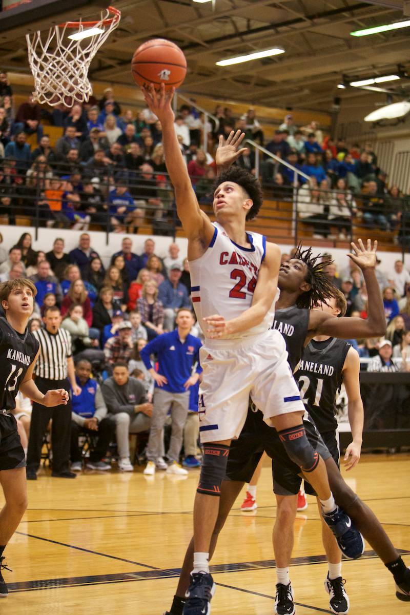 Marmion Academy's Trevon Roots with the layup against Kaneland at the Class 3A Regional Final at Kaneland on Saturday, Feb.25, 2023.