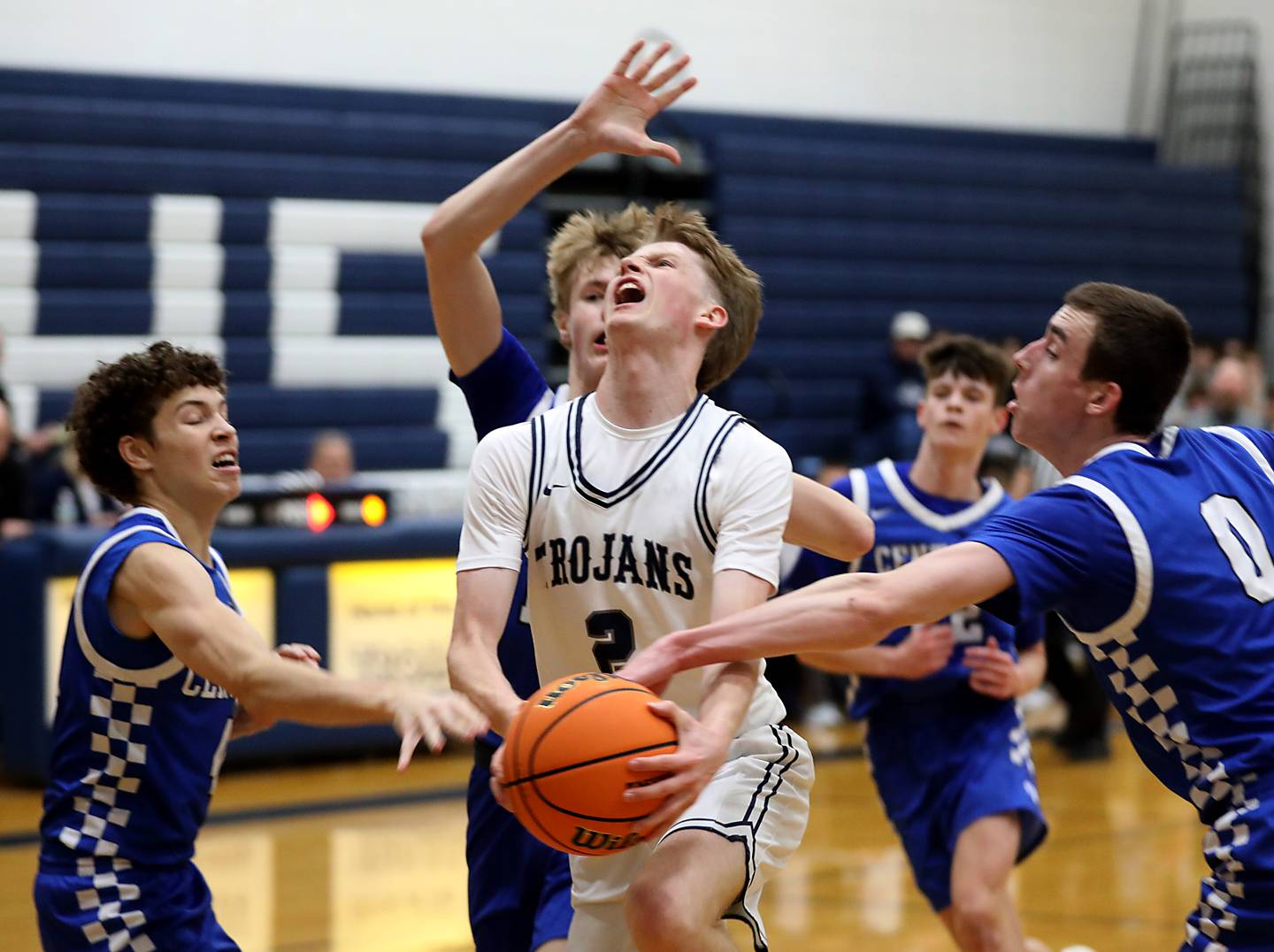 Cary-Grove's AJ Berndt drives to the basket between Burlington Central's Ryan Carpenter (left) and Patrick Magan (right) during a Fox Valley Conference  boys basketball game on Wednesday Jan. 7,  2026, at Cary-Grove High School, in Cary.