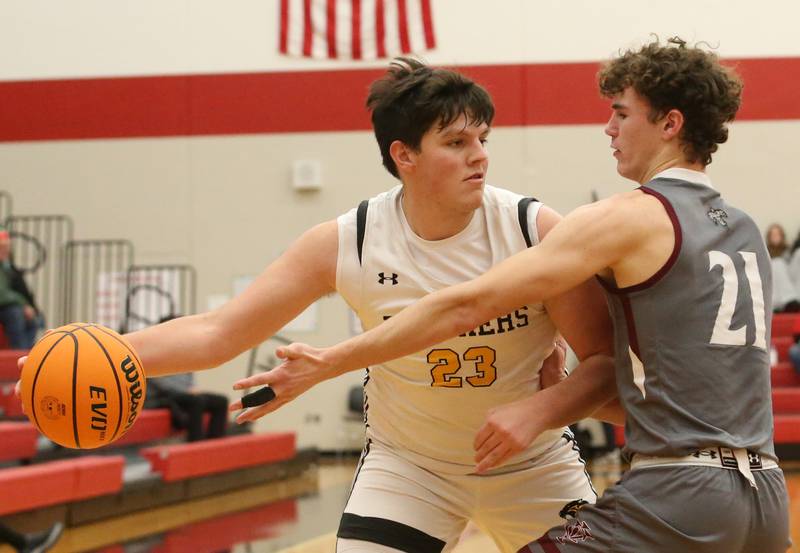 Putnam County's Jaden Stoddard looks to pass the ball around Illinois Valley Central's Brady Wrad during the 50th annual Colmone Classic on Thursday, Dec. 12, 2024 at Hall High School.
