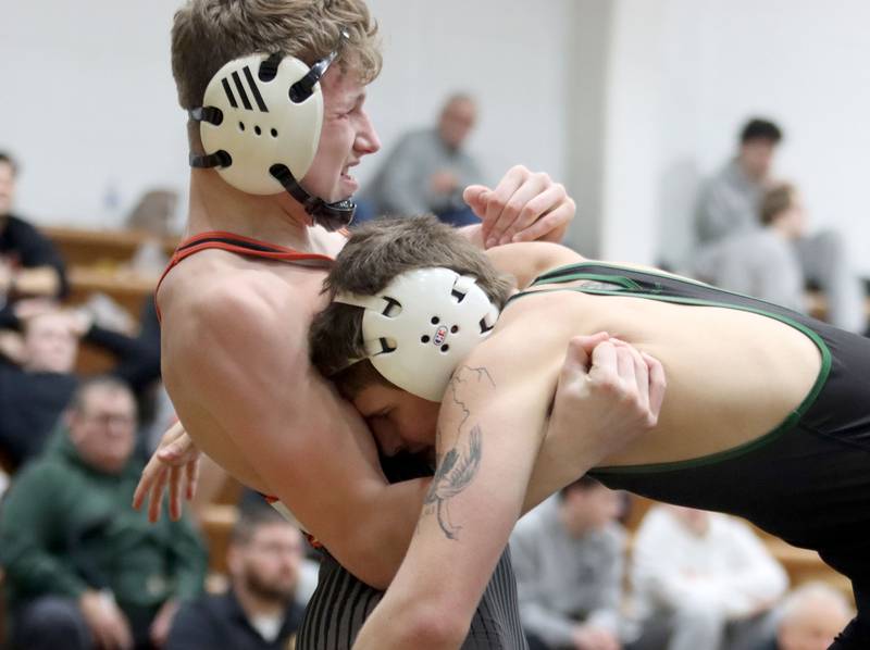 Crystal Lake South’s Nathan Randle, right, battles Crystal Lake Central’s Daniel Zuehlke at 138 pounds in boys wrestling IHSA Class 2A Regional championship bout action on Saturday, Jan. 31, 2026, at Harvard High School in Harvard.