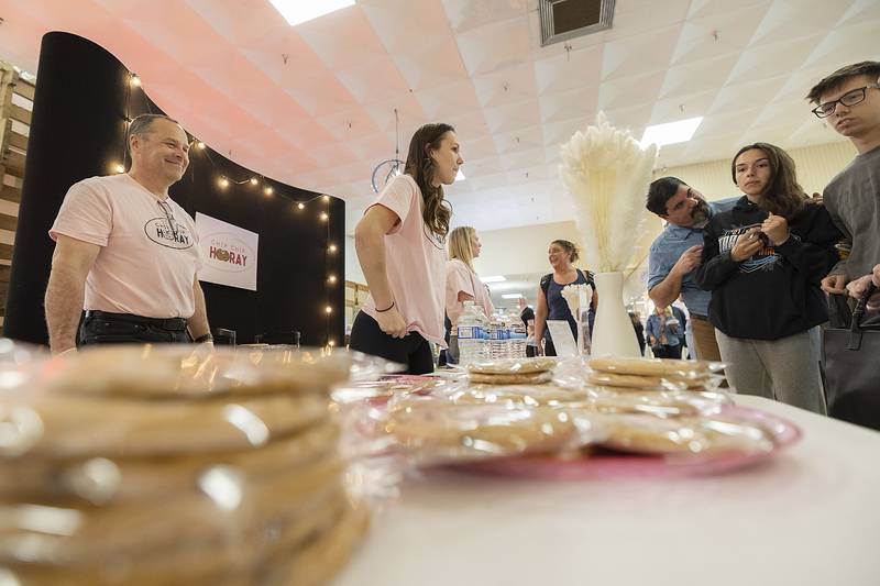 Chip Chip Hooray business leader Makenna Arickx of Rock Falls High School, works to sell her giant chocolate chip cookies to hungry customers Wednesday, April 26, 2023.