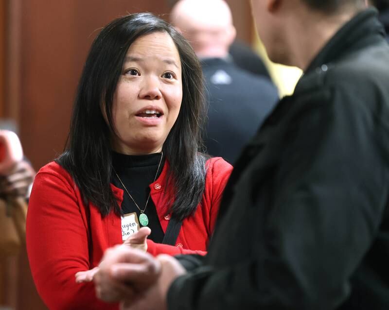 DeKalb mayoral candidate Linh Nguyen, who will have to win a primary to get her name on the ballot, talks to an attendee Wednesday, Feb. 19, 2025, at the DeKalb Area Rental Association and DeKalb Area Builders Association Candidate Night at Faranda's Banquet Center in DeKalb.
