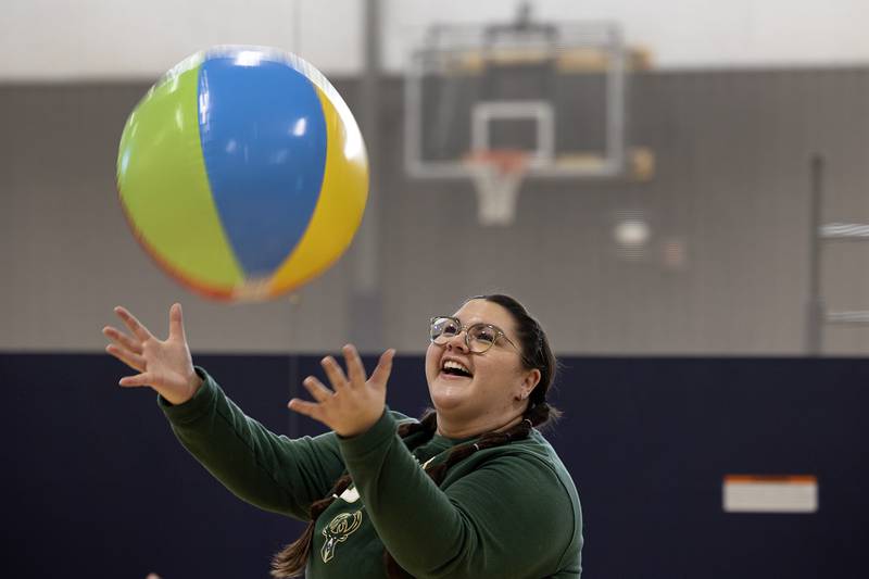 St. Anne’s kindergarten teacher Sydney Ybarra snags a beach ball that’s being tossed around during an afternoon of fun at The Facility in Dixon Tuesday, Jan. 31, 2023. The school was recognizing Catholic Schools Week with the field trip.