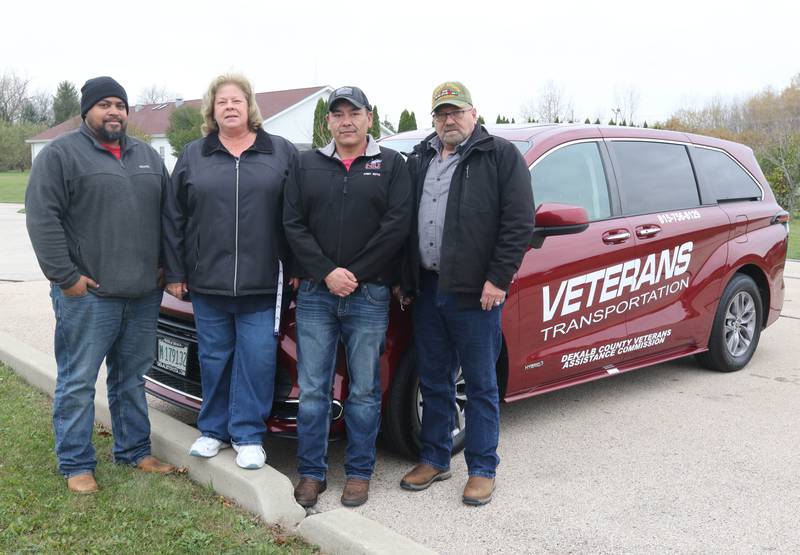 (From left) Will Sutton, veterans assistant service officer with the DeKalb County Veterans Assistance Commission; Tammy Anderson, superintendent of VAC; Justin Wolfe, veterans assistant service officer; and Scott Bennett, veterans assistant service officer, stand outside of their office Friday, Nov. 3, 2023, in DeKalb.