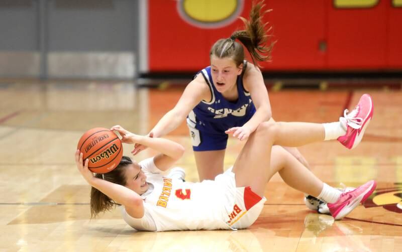 Batavia’s Brooke Carlson tries to keep the ball away from Geneva’s Caroline Madden during the Class 4A Batavia Sectional final on Thursday, Feb. 22, 2024.