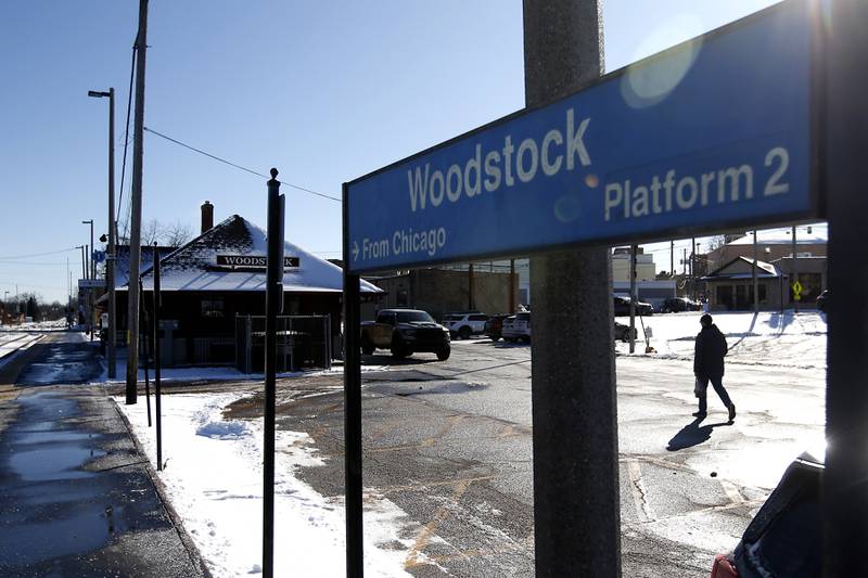 A man walks on Thursday, Jan. 23. 2025, towards the Metra station in Woodstock.