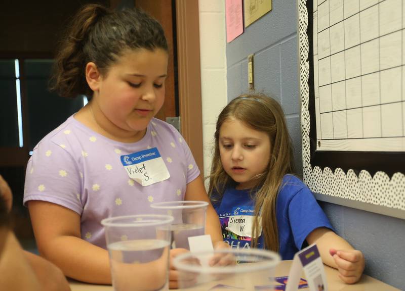 Violet and Sienna use different materials to look through cups of water during the Camp Invention on Wednesday, ?June 5, 2024 at Central Intermediate School in Ottawa. For over 30 years, the National Inventors Hall of Fame has inspired millions of chldren through it's flagship summer program. The weeklong program is led by qualified local educators in the Ottawa area along with local high schoolers volunteering. The camp is for students from kindergarten through sixth grades. Donations were made possible from Covia, US Silica, CAVIC, Financial Plus, Pilkington and community members. With the help of donations,  A total of 74 students were able to participate in this years camp.
