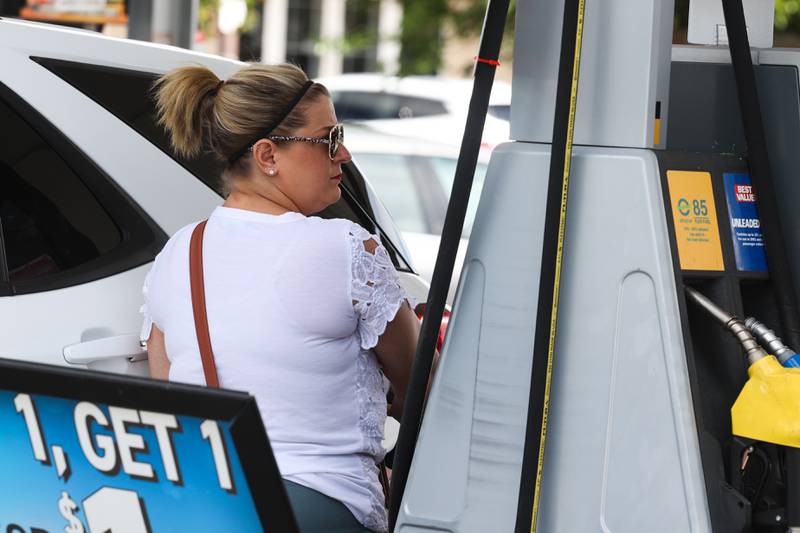 Angela Andrews, of Joliet, stops at gas station to fill up. Tuesday, Aug. 9, 2022, in Joliet.