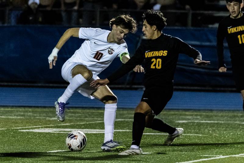 Lincoln-Way Central's Connor Pate and St. Laurence's Heriberto Luna fight for control of the ball during a Class 3A Boys Soccer Super-Sectional game at Lyons Township High School’s South Campus on Nov. 3, 2025.