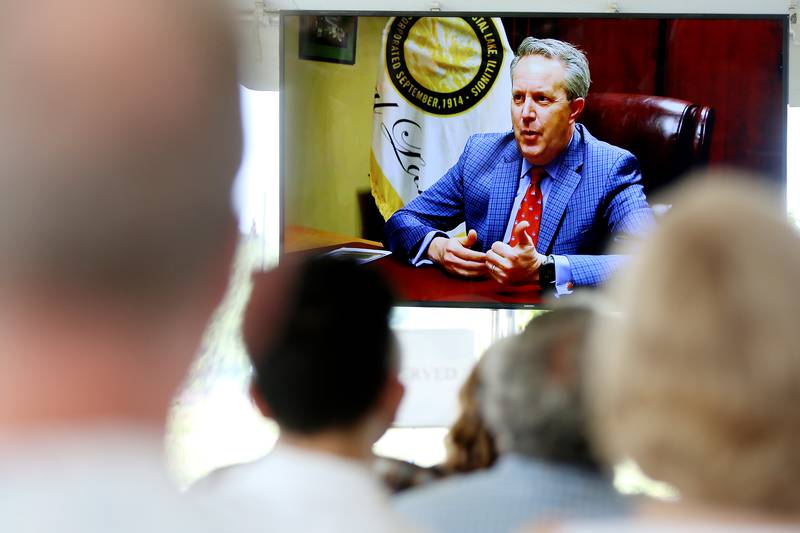 Former Crystal Lake Mayor Aaron Shepley is seen in a video speaking about the city he grew up in and loved during a celebration of life honoring him on Saturday, June 12, 2021 at Three Oaks Recreation Area  in Crystal Lake.  Shepley passed away last year.