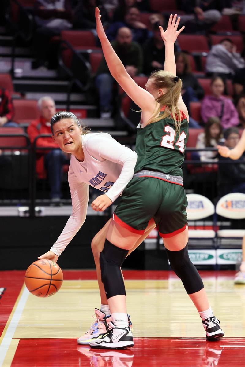 Nazareth Academy's Danielle Scully (23) looks past Lincoln's Tori Geriets (24) for an open teammate during the IHSA Class 3A girls basketball championship game at the CEFCU Arena on the campus of Illinois State University Saturday March 4, 2023 in Normal.