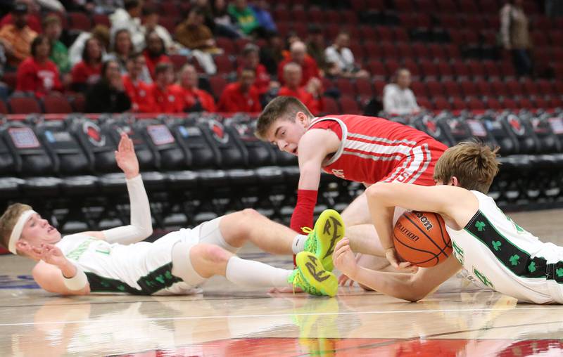 Seneca's Cameron Shriey falls on a loose ball with the help of teammate Paxton Giertz over Streator's Cade Peterson during a game on Tuesday, Dec. 21, 2023 at the United Center in Chicago.