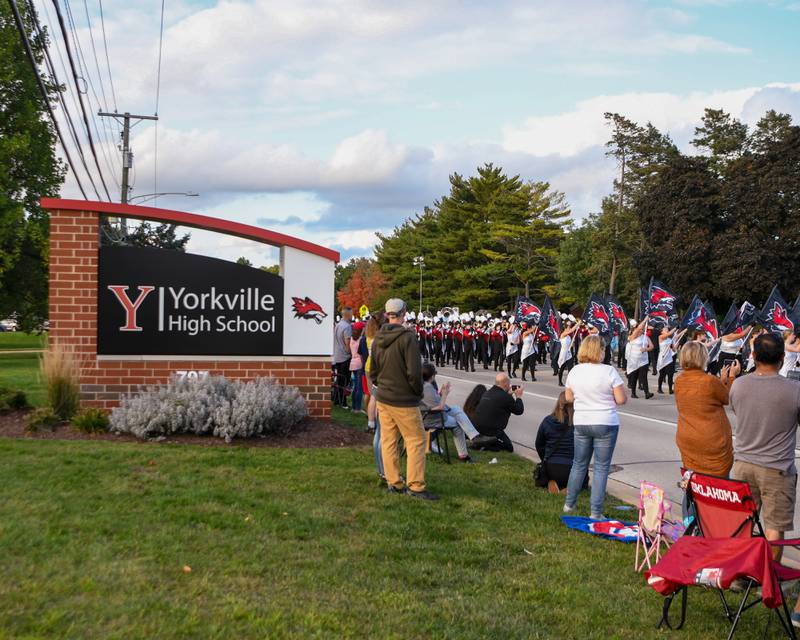 The Yorkville High School marching band leads the homecoming parade past the high school on Thursday, Sept. 28, 2023.