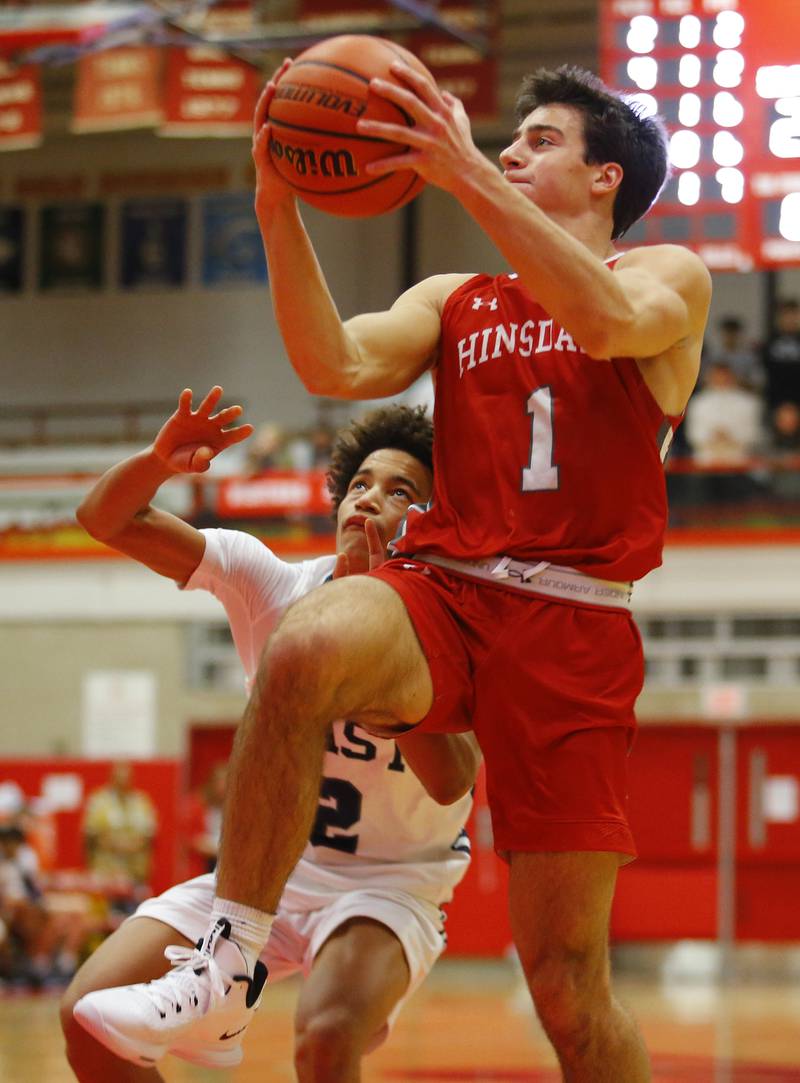 Hinsdale Central's Evan Phillips (1) takes it to the rim during the Hinsdale Central Holiday Classic championship game between Oswego East and Hinsdale Central high schools on Thursday, Dec. 29, 2022 in Hinsdale, IL.
