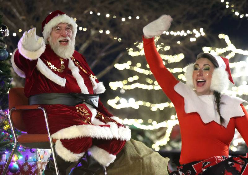 Santa Claus and Elfie approach the Egyptian Theatre aboard their truck Thursday, Dec. 4, 2025, during the annual Lights on Lincoln and Santa Comes to Town event hosted by the DeKalb Chamber of Commerce.