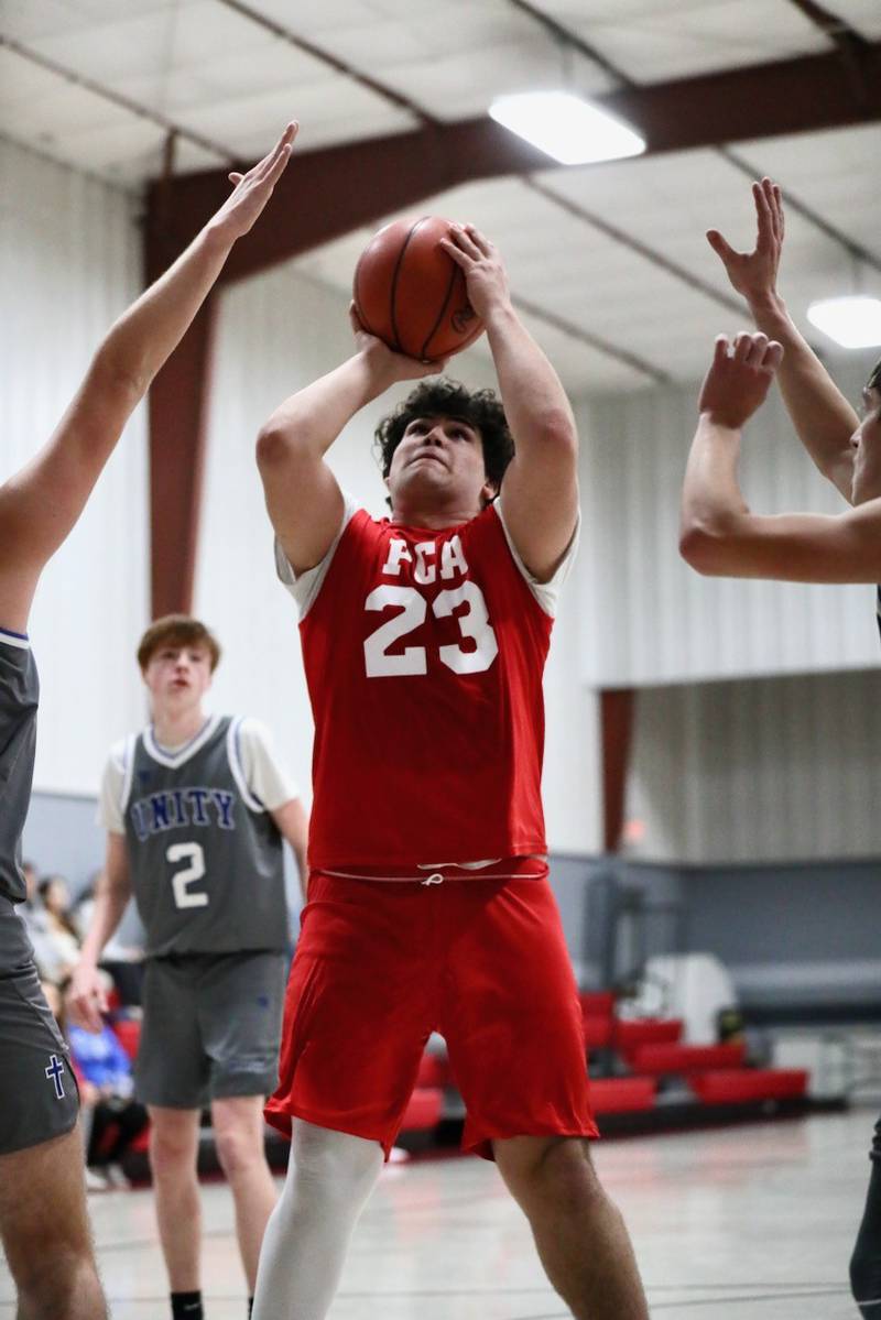 Princeton Christian Academy's Aaron Dixon shoots against Fulton Unity Christian Thursday night at PCA's Howard Hoffman Gym. PCA won 39-35.
