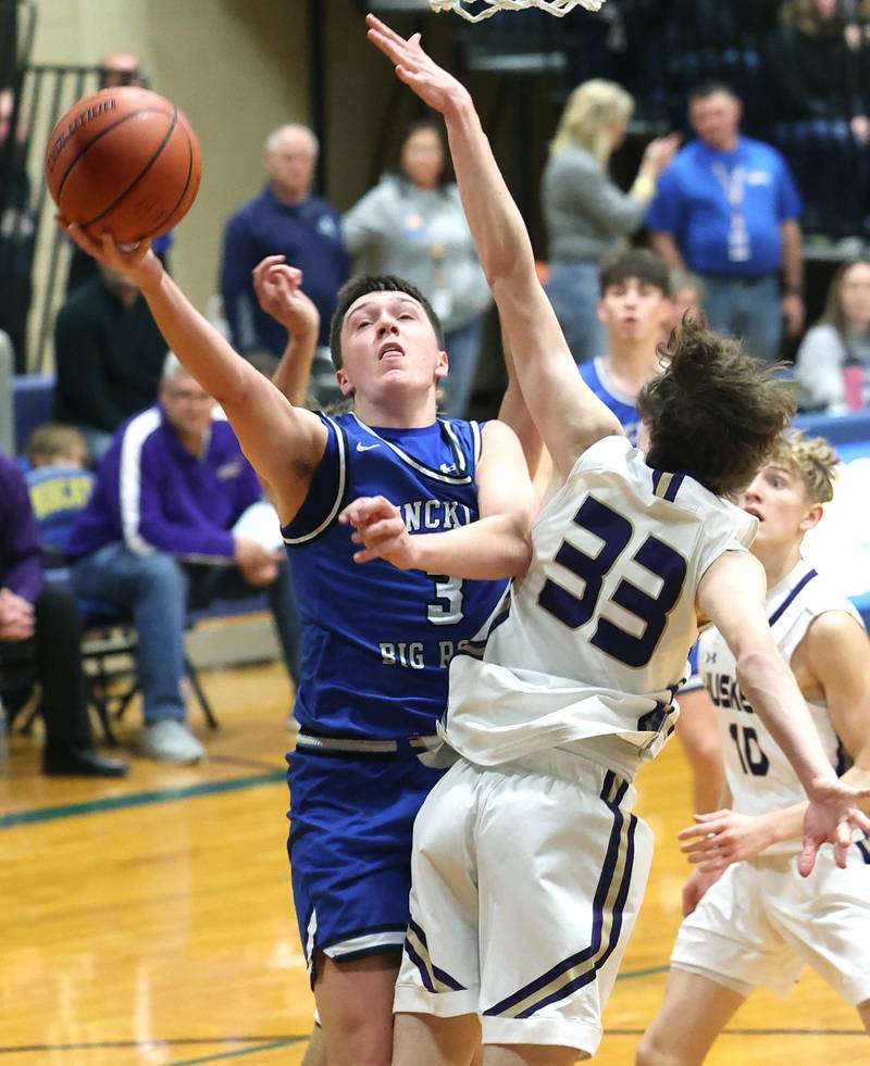 Hinckley-Big Rock's Ben Hintzsche gets to the basket around Serena's Hunter Staton Friday, Feb. 3, 2023, during the championship game of the Little 10 Conference Basketball Tournament at Somonauk High School.