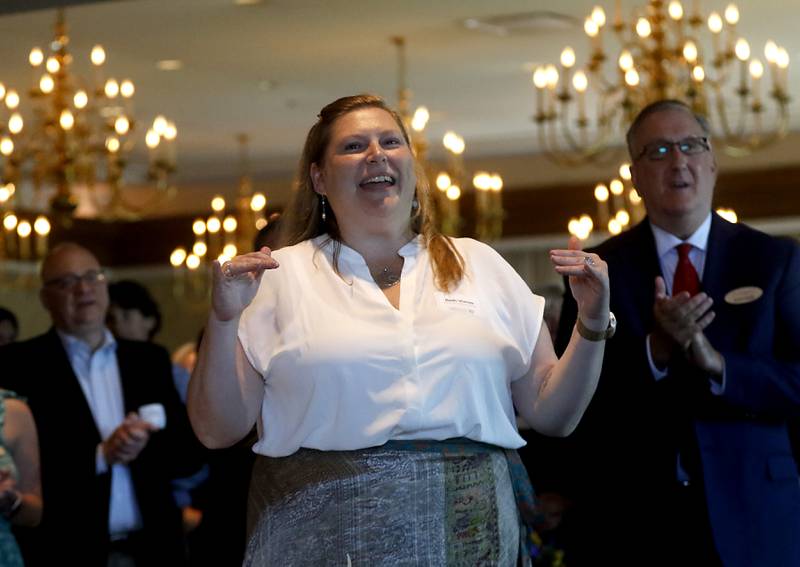 Beth Vonau repeats Lisa Hoeppel's cheer mantra during the Northwest Herald's Women of Distinction award luncheon Wednesday June 29, 2022, at Boulder Ridge Country Club, 350 Boulder Drive in Lake in the Hills. The luncheon recognized 10 women in the community as Women of Distinction plus Hoeppel as the first recipient of the Kelly Buchanan Woman of Inspiration award. Hoeppel was a volunteer cheer coach, a volunteer with school and other local organizations, and a substitute teacher. She succumbed to her third battle with breast cancer April 10 at the age of 40.