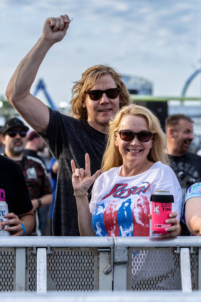 Mokena residents Shannon and Bill Berge rock out to 7th Heaven during Taste of Joliet on June 20, 2025.