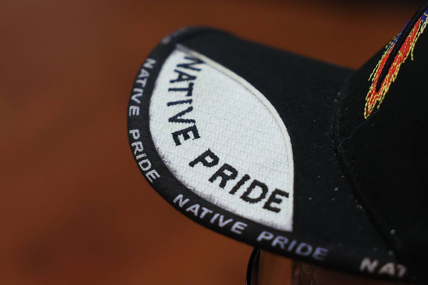 Ted Turjillo, of the Passamaquoddy tribe and Native American activist, wears a Native Pride hat as he listens to Joseph “Standing Bear” Schranz, from the Ojibwa tribe at White Earth reservation in Minnesota, speaks at a round table discussion on the destructive and dehumanization of Native American culture and their people at Joliet Junior College on Thursday, Nov. 9, 2023 in Joliet.