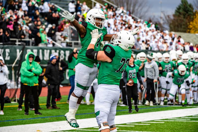 Providence Catholics Jamari Tribett and James Barry celebrate Tribetts touchdown during the 2nd round IHSA playoff game against Joliet Catholic Academy Saturday Nov. 5, 2022 at Providence Catholic High School in New Lenox