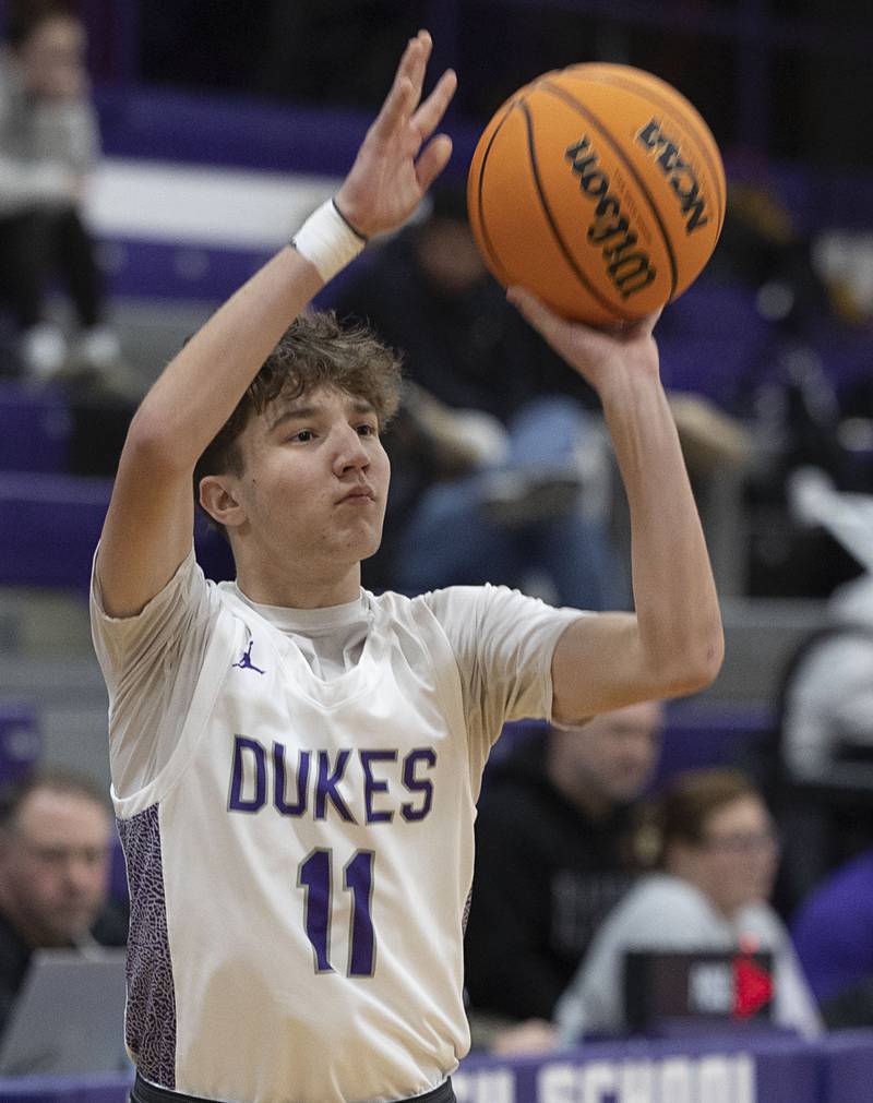 Dixon’s Brody Nicklaus puts up a three point shot against Alleman Wednesday, Jan. 28, 2026.