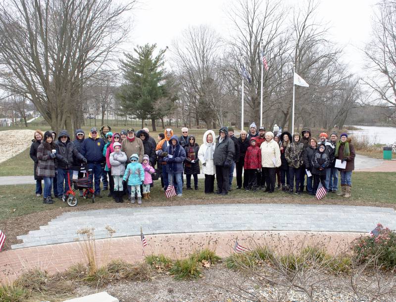 Local officials, friends and family members gathered Nov. 19 at Oswego's Veteran Serenity Park to mark the installation of more bricks honoring veterans and military support groups. (Photo provided by Dave Krahn
