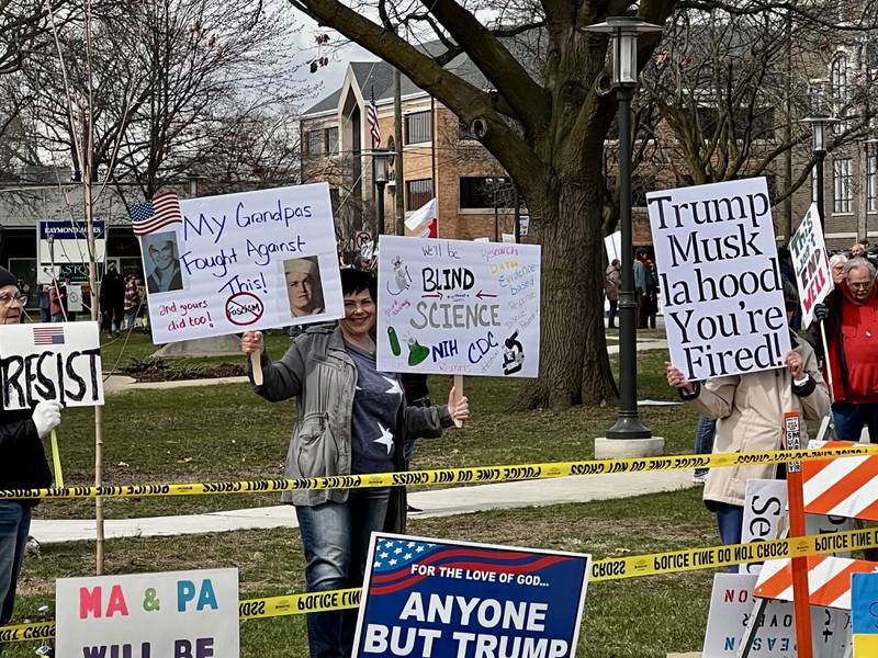 Protestors gather in front of the Grandon Civic Center and the post office on Saturday, April 5, in Sterling to voice concerns over President Donald Trump and his administration.