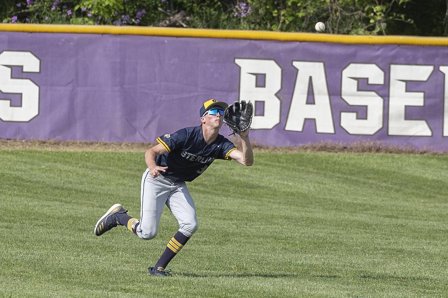 Sterling’s Dylan Ottens comes in to catch a liner in left field against Dixon Tuesday, May 16, 2023.