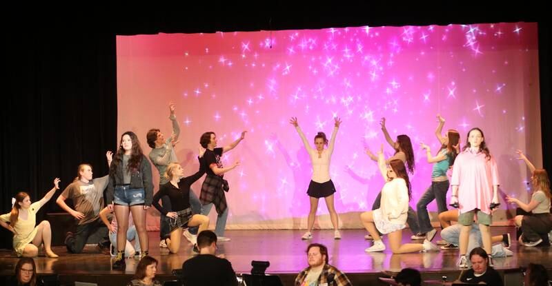 Members of the cast of "Mean Girls-High School Version act out a scene out a scene during a rehearsal on Monday, March 10, 2025 in Matthiessen Auditorium at La Salle-Peru Township High School.