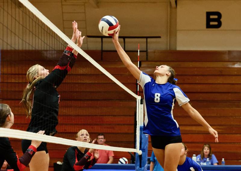 Princeton Keighley Davis tries to hit over E-P's Lauren Abbott Monday night at Prouty Gym. E-P won 25-13, 25-15.