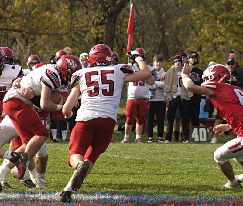 Fulton's Jimmy Crimmins is wrapped up by Morrison's defense Saturday, Oct. 28, 2023 in round one of the Class 1A football playoffs.