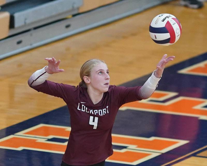 Lockport's Megan Consigny (4) serves the ball against Oswego during a class 4A Oswego Sectional semifinal match at Oswego High School on Monday, Oct. 30, 2023.