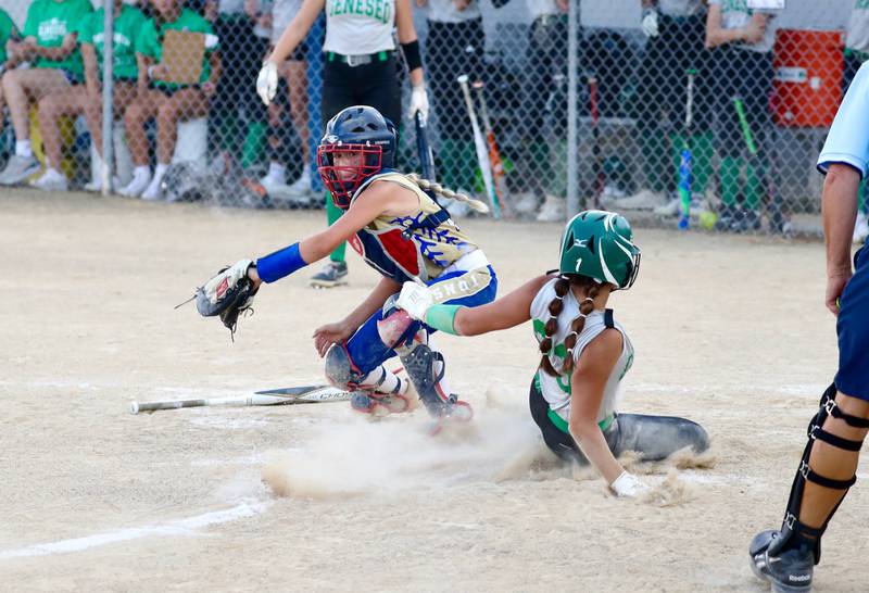 Princeton Logan catcher Kiyrra Morris takes the throw home in Thursday's season opener.